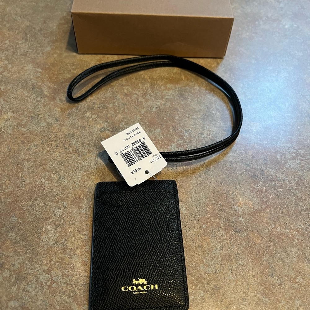Black leather Coach luggage tag (new with tags and box)